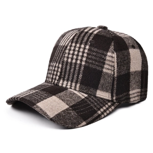 Detail of classic plaid pattern on thick wool baseball cap with curved brim and 6-panel crown