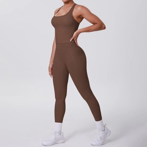 Detail of coffee brown yoga set featuring high waist leggings with side pockets and vest