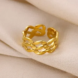 Detail of gold woven open ring with triple layered mesh texture on silk fabric