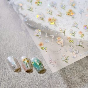 3D floral nail stickers with sunflowers and ribbons on gray textured background