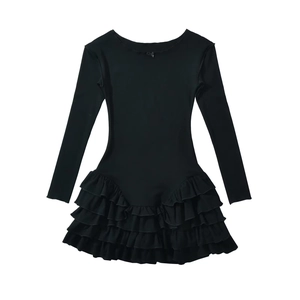 Detailed flat-lay of a black mini dress featuring layered ruffles and neckline bow detail