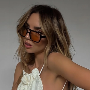 Fashionable double-bridge aviator sunglasses with tortoiseshell frames and amber lenses