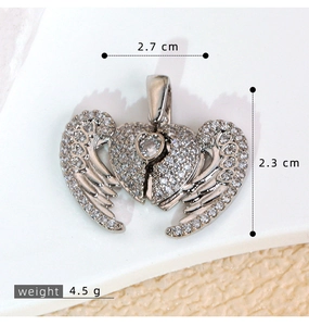 Detailed view of silver zircon heart wing pendant showing 2.7 cm width and 2.3 cm height