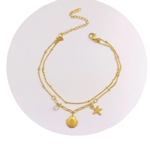 Gold starfish and shell double-layer titanium ankle chain with sparkling zircon detail