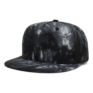 Detailed view of kids' hip-hop baseball cap featuring black and white tie-dye canvas texture