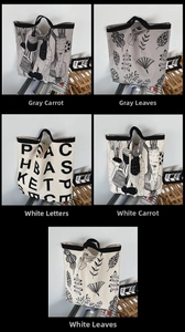 Detail view of canvas tote bags with various prints including letters and carrot motifs