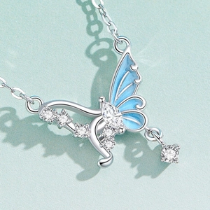 Elegant butterfly pendant necklace with blue enamel and white zircon stones in silver finish