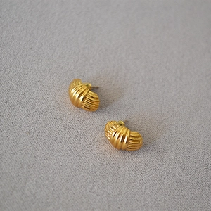 Elegant gold striped stud earrings with pleated fan design on gray texture background