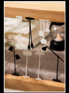 Detail of vintage lantern paper silhouettes on wood with warm ambient lighting