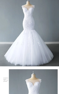 Detail of V-neck lace embroidery and multi-layered tulle on a white mermaid wedding dress