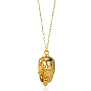 Macro shot of 18K gold plated skull pendant with snake relief and zircon eye detail