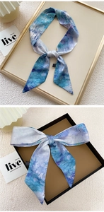 Detail of artistic watercolor print on long silky ribbon scarf for bags or hair styling