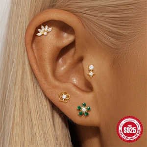 Detailed close-up of S925 sterling silver Christmas bell and floral crystal ear studs set