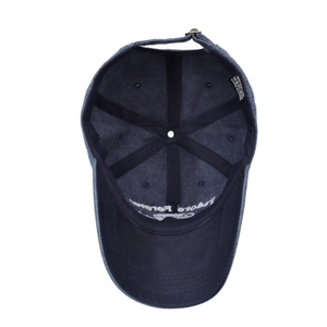Navy blue washed cotton baseball cap interior detail with 100% cotton label and strap