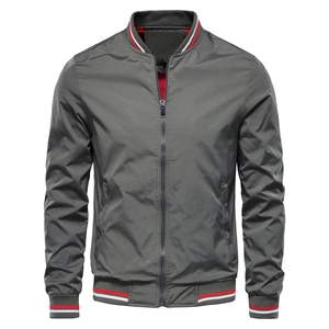 Detail of red and white striped ribbed cuffs and collar on men's gray baseball jacket