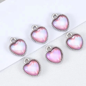 Set of six pink heart pendants with silver beaded edges and iridescent finish