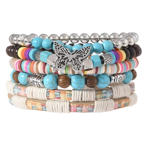 Bohemian multilayer bracelet set with turquoise beads, wooden beads and silver butterfly charm