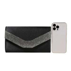Elegant black silk clutch bag with V-shaped crystal decor and smartphone for size reference