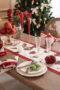 Festive table setting with jacquard Christmas runner, gold candle holders and dinnerware