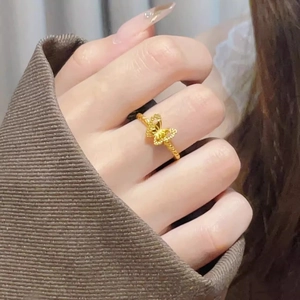 Adjustable gold butterfly ring with hollow design for women showing elegant hand wear style