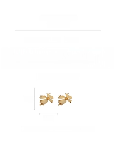 Detailed specs of matte gold floral earrings with silver pins and copper base
