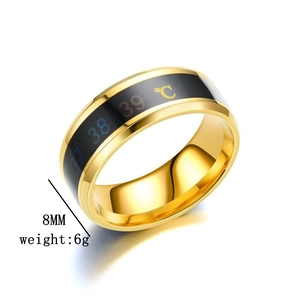 Detail view of 8mm golden stainless steel temperature ring showing weight and width