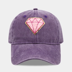 Detail of vintage washed purple baseball cap with diamond-shaped glitter patch embroidery