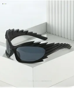 Detail showing the matte black spiked frame and textured material of these sports sunglasses