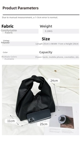 Detail showing black lychee grain texture and interior polyester lining of the bag