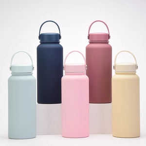 Collection of wide mouth insulated bottles in five matte colors on minimalist white stands