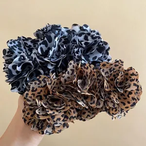 Leopard print fabric flower hair clip in brown and grey tones for elegant styling
