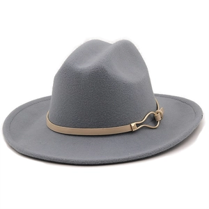 Detail of grey-blue wool fedora featuring flat brim and khaki leather strap with gold buckle