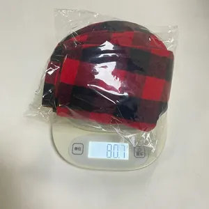 Weight measurement of six small red and black buffalo plaid Christmas sock decorations