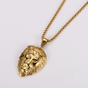 Macro shot of 3D lion head pendant with golden finish on a premium stainless steel chain