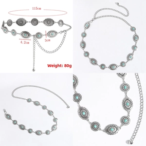 Detail view of bohemian silver metal chain belt with engraved turquoise oval medallions