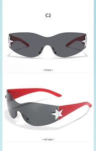 Detail view of red kids sunglasses with grey shield lenses and silver star accents