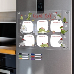 Magnetic acrylic wish list board on fridge with Christmas dinosaur theme and markers