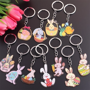 Detailed flat lay of acrylic Easter keychains with bunny, chick, and egg designs