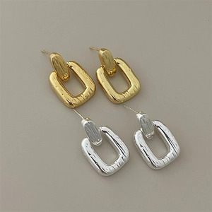 Minimalist double square gold and silver metal earrings with subtle water ripple texture