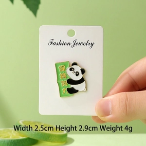 Detailed close-up of a cute panda enamel pin with size specs and fashion jewelry card