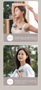 Dual-head neck fan in light grey showing portable use for sports and outdoor shopping