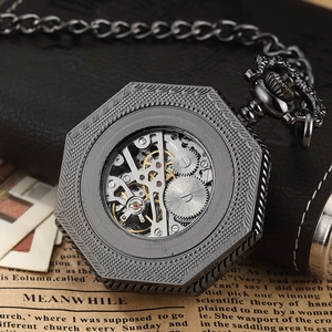Macro detail of gunmetal octagonal mechanical pocket watch with skeleton movement