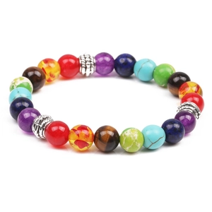 Macro shot of 8mm colorful volcanic stone beads with silver spacers on white background