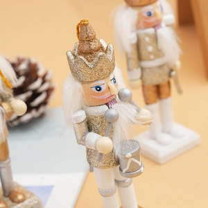 Detail of 12cm gold and white glitter wooden nutcracker soldier drummer with crown