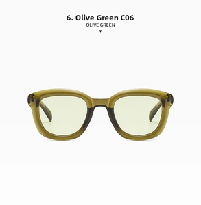 Detail view of vintage full-frame sunglasses in olive green with amber texture and C06 model