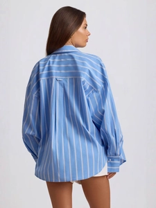 Back view of a blue and white striped oversized long-sleeved shirt with drop shoulders
