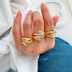 Three-tone 18K gold plated layered ring featuring micro-pave cubic zirconia accents