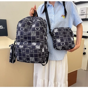 Three-piece black grid backpack set with rabbit print including crossbody and coin pouch
