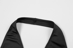 Macro shot of stitching details and high-elasticity fabric on black halter lace dress