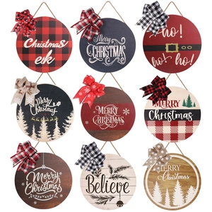 Collection of nine 28cm Christmas wooden door signs with assorted festive bow knots